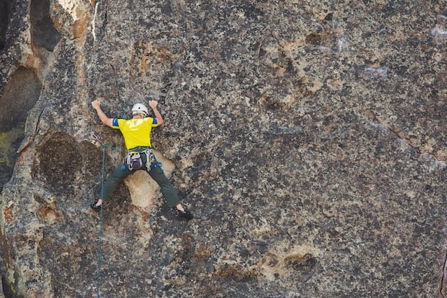 A man experienced climbing to enjoy nature 